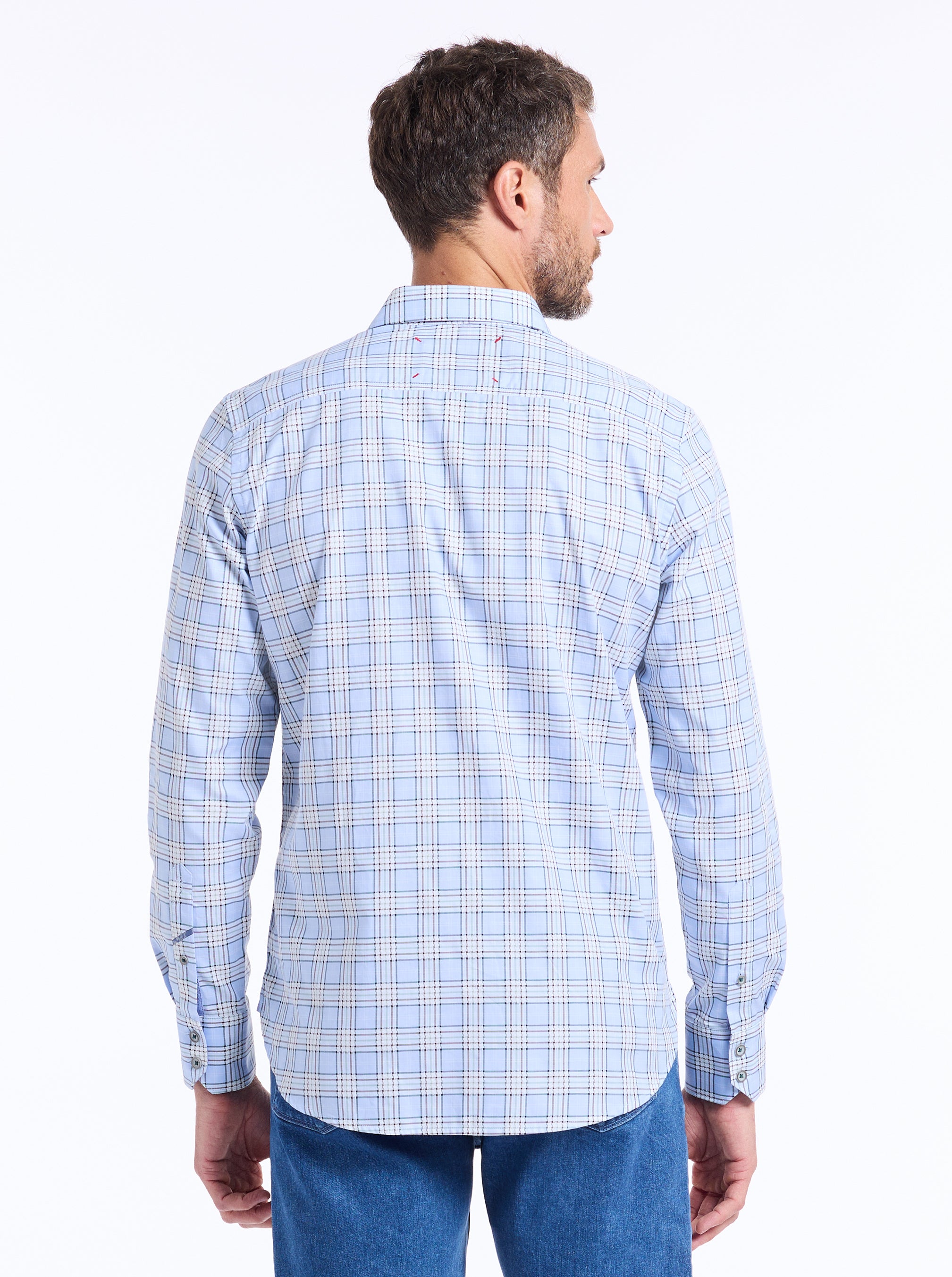 Man wearing a blue checkered shirt on a white background
