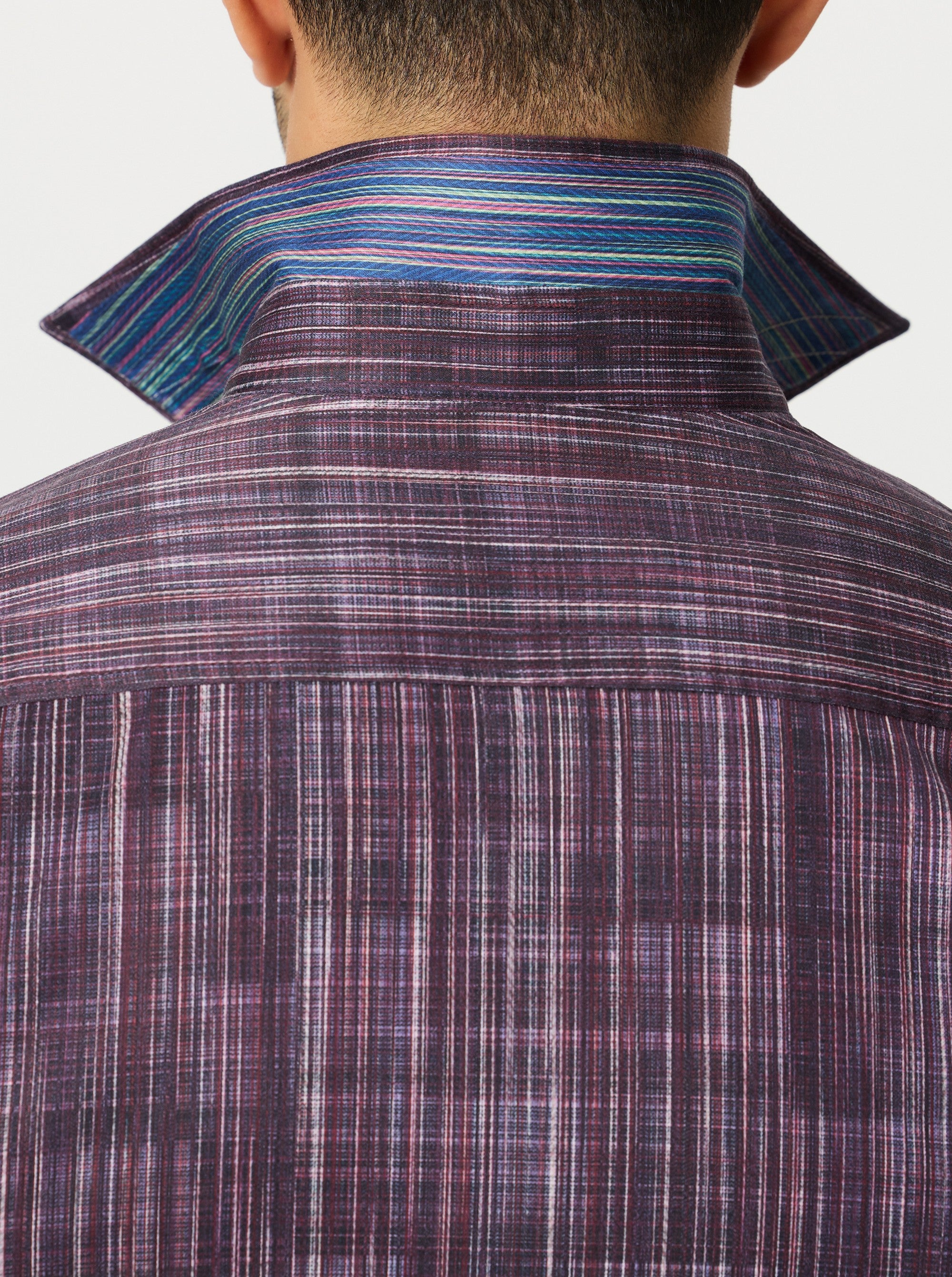 Close-up of a vertical line patterned shirt with a focus on the collar and back.