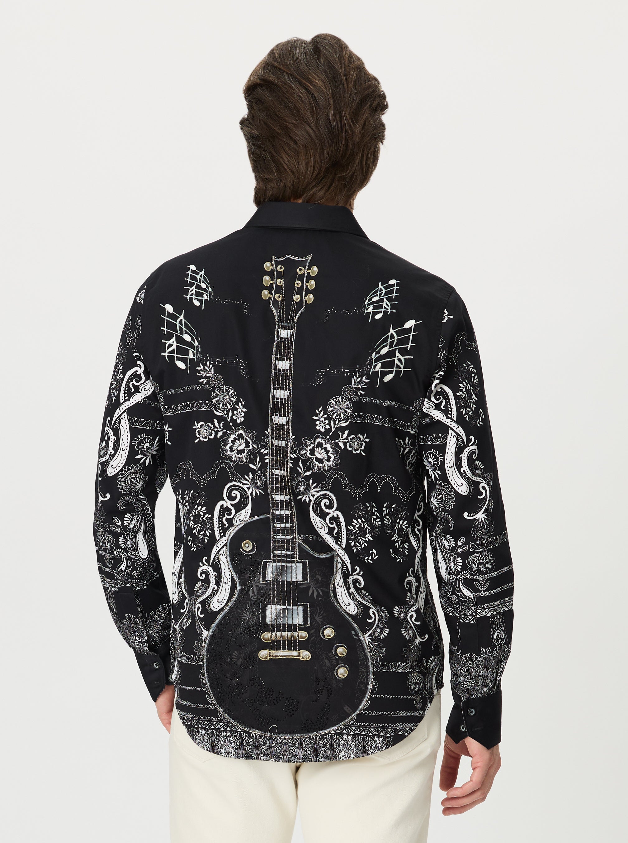 Black shirt with white guitar design on a white background