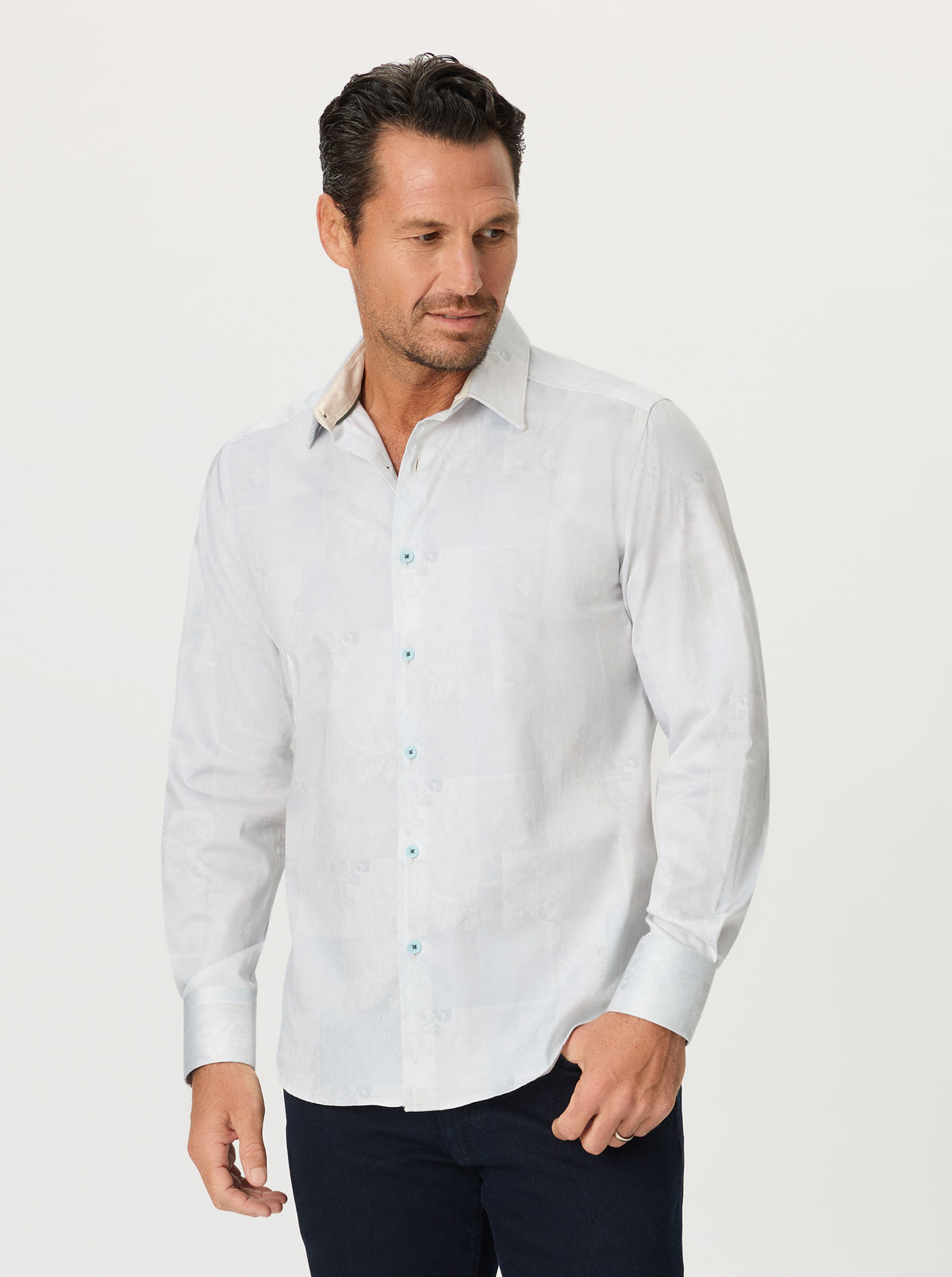Man wearing a light color shirt on a white background
