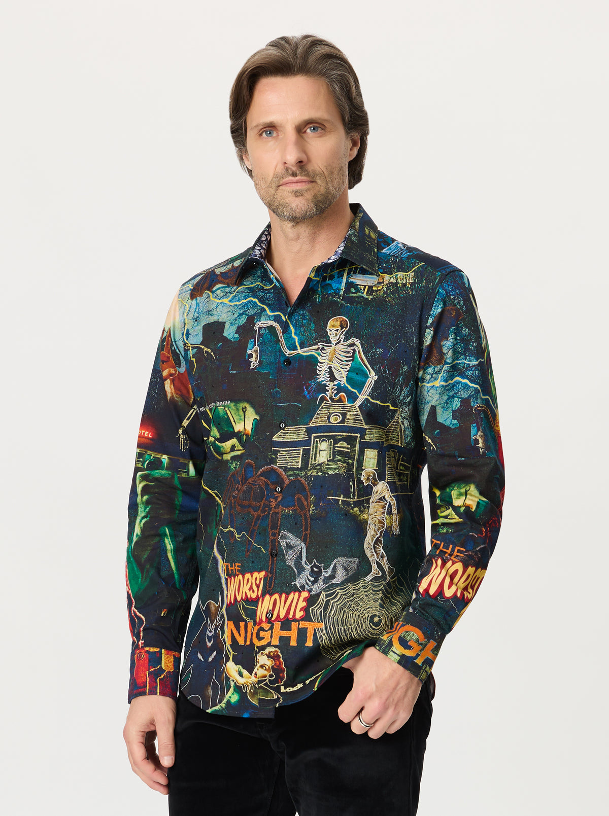 Man wearing a colorful shirt with movie-themed design on a white background