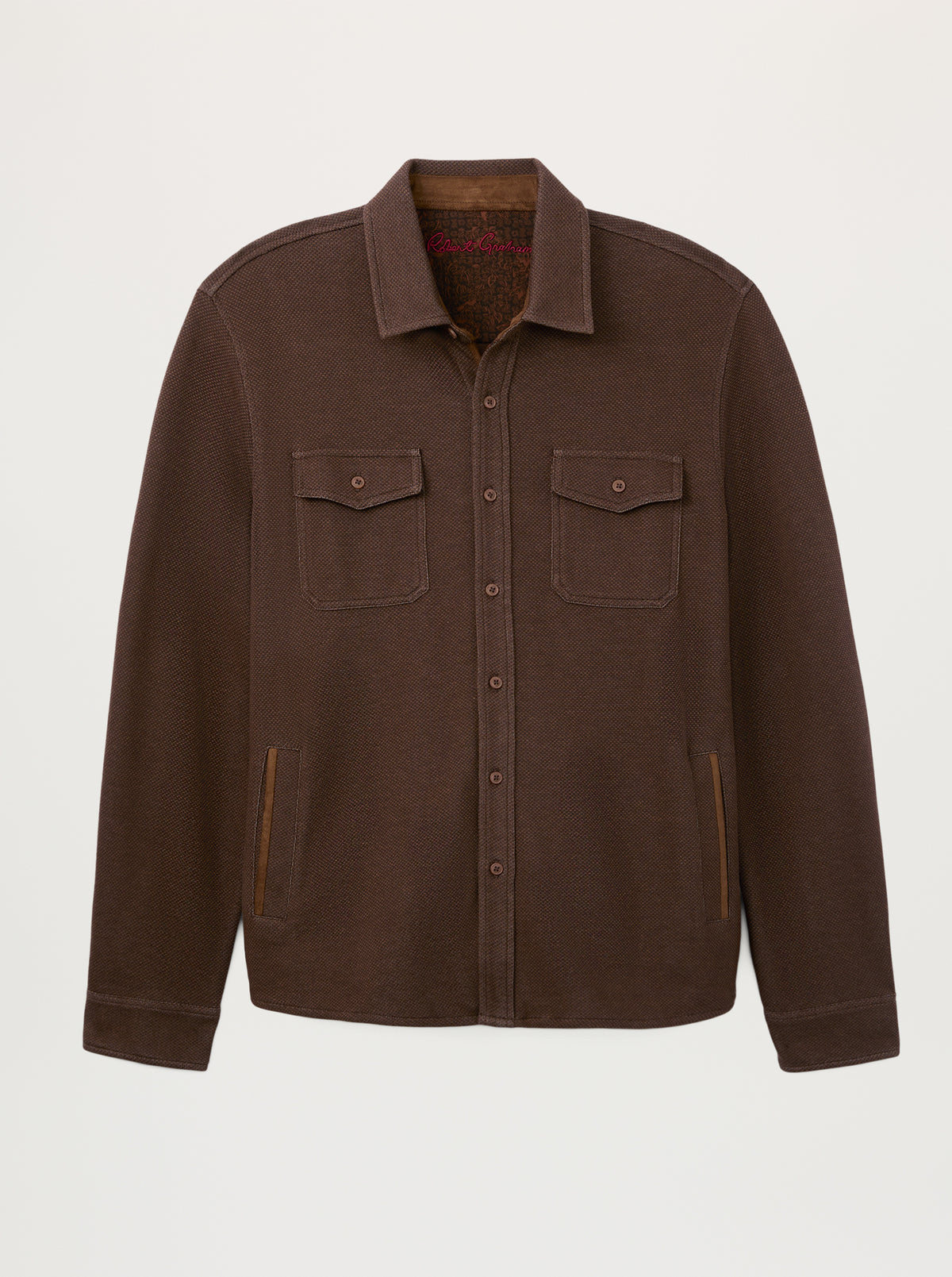 A dark brown button-up overshirt jacket with two chest flap pockets and side welt pockets, displayed on a clean, light gray background.