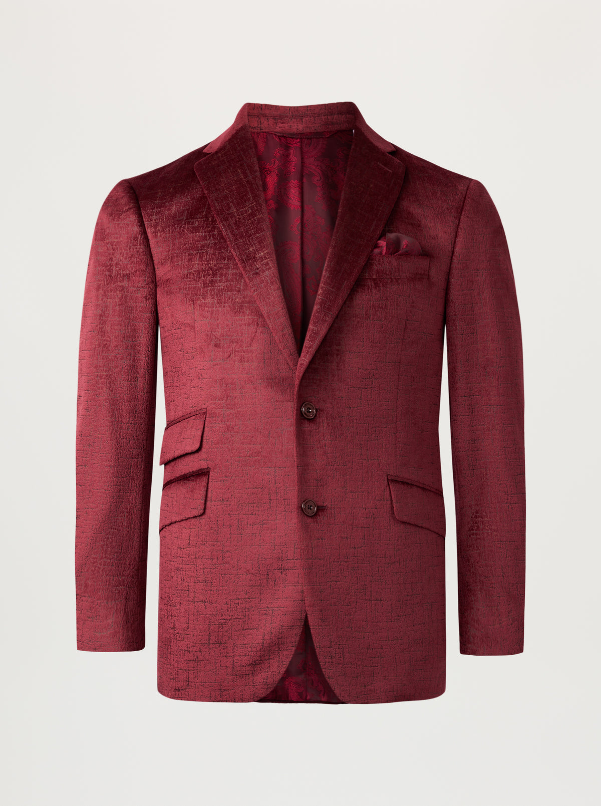 A textured burgundy velvet blazer with notch lapels, two front buttons, flap pockets, and a matching pocket square, displayed on a neutral light gray background.