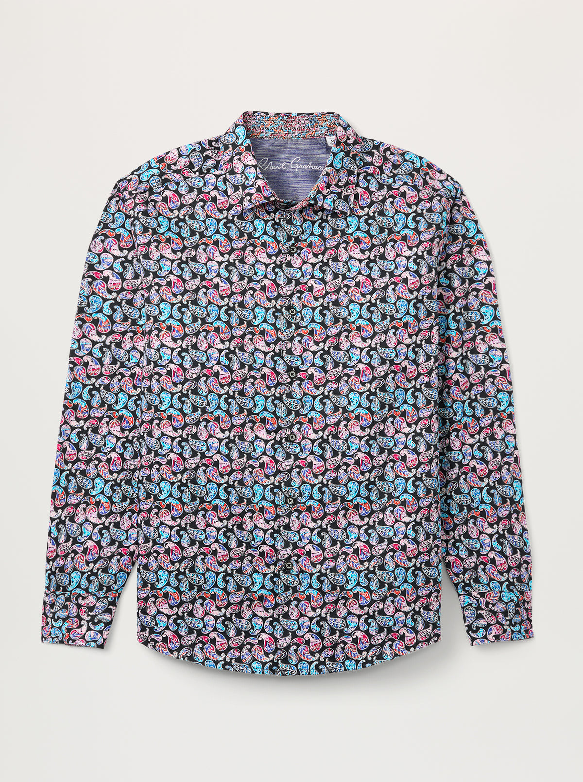 A long-sleeve button-up shirt with an all-over dense floral pattern in pink, light blue, and black on a light gray background, shown flat against a light gray studio backdrop.