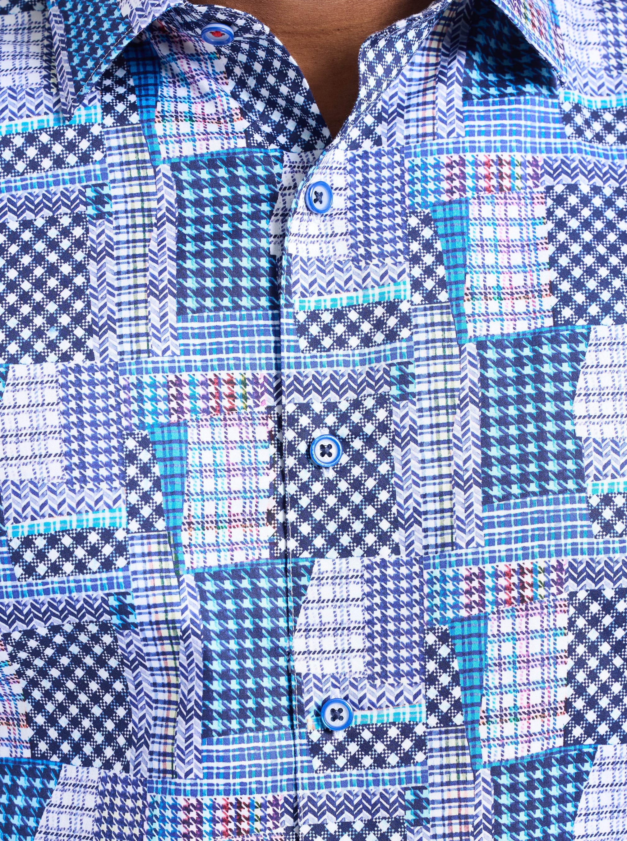 Close-up of a blue and white checkered shirt with a patchwork pattern.