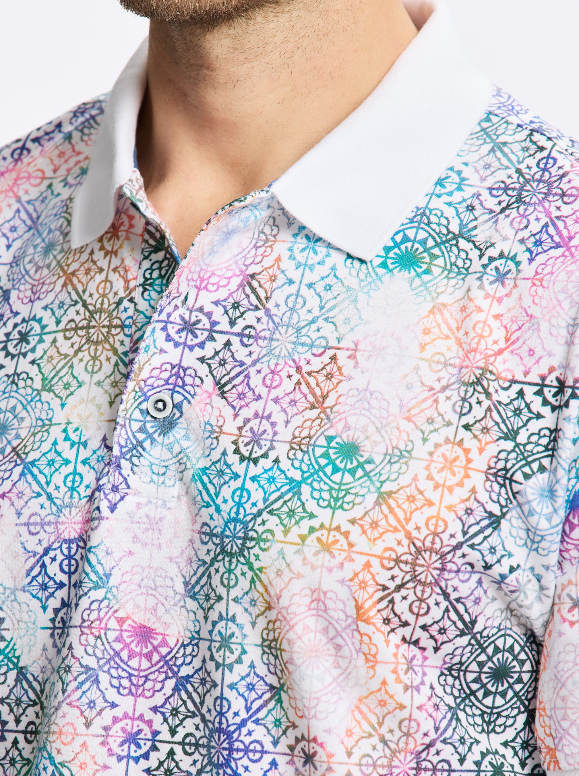 Close-up of a colorful patterned polo with a white collar