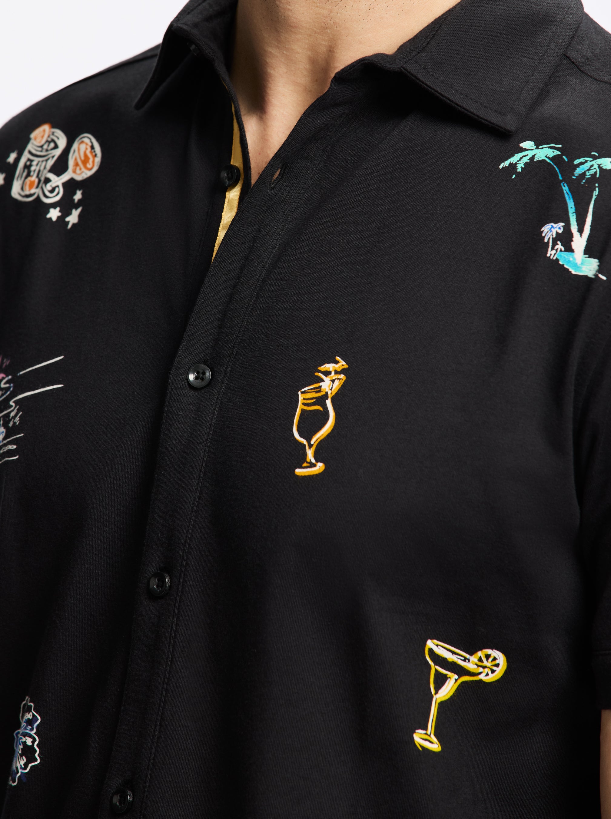 Black shirt with colorful embroidered drinks designs