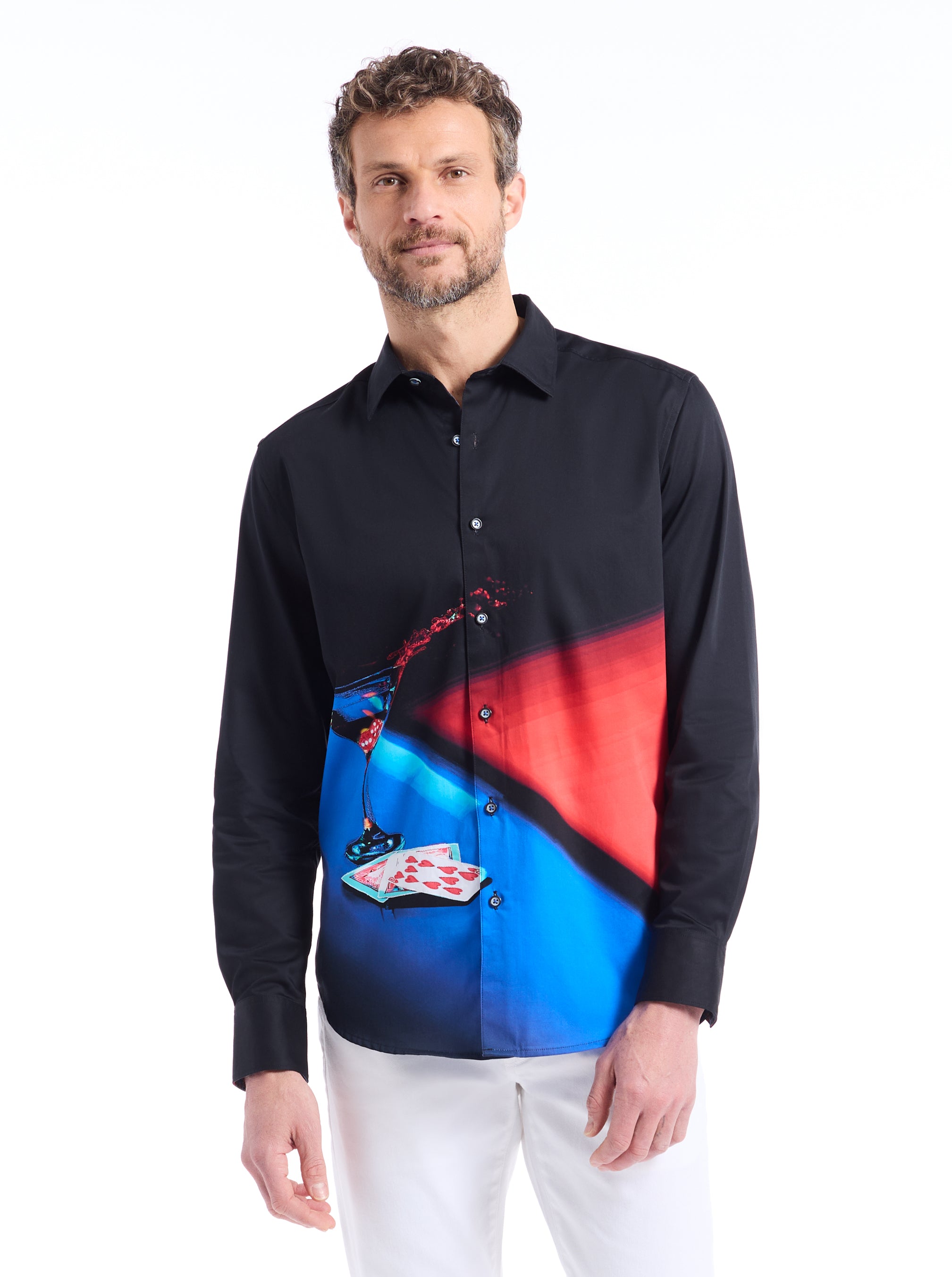 Man wearing a black shirt with a colorful abstract design on a white background