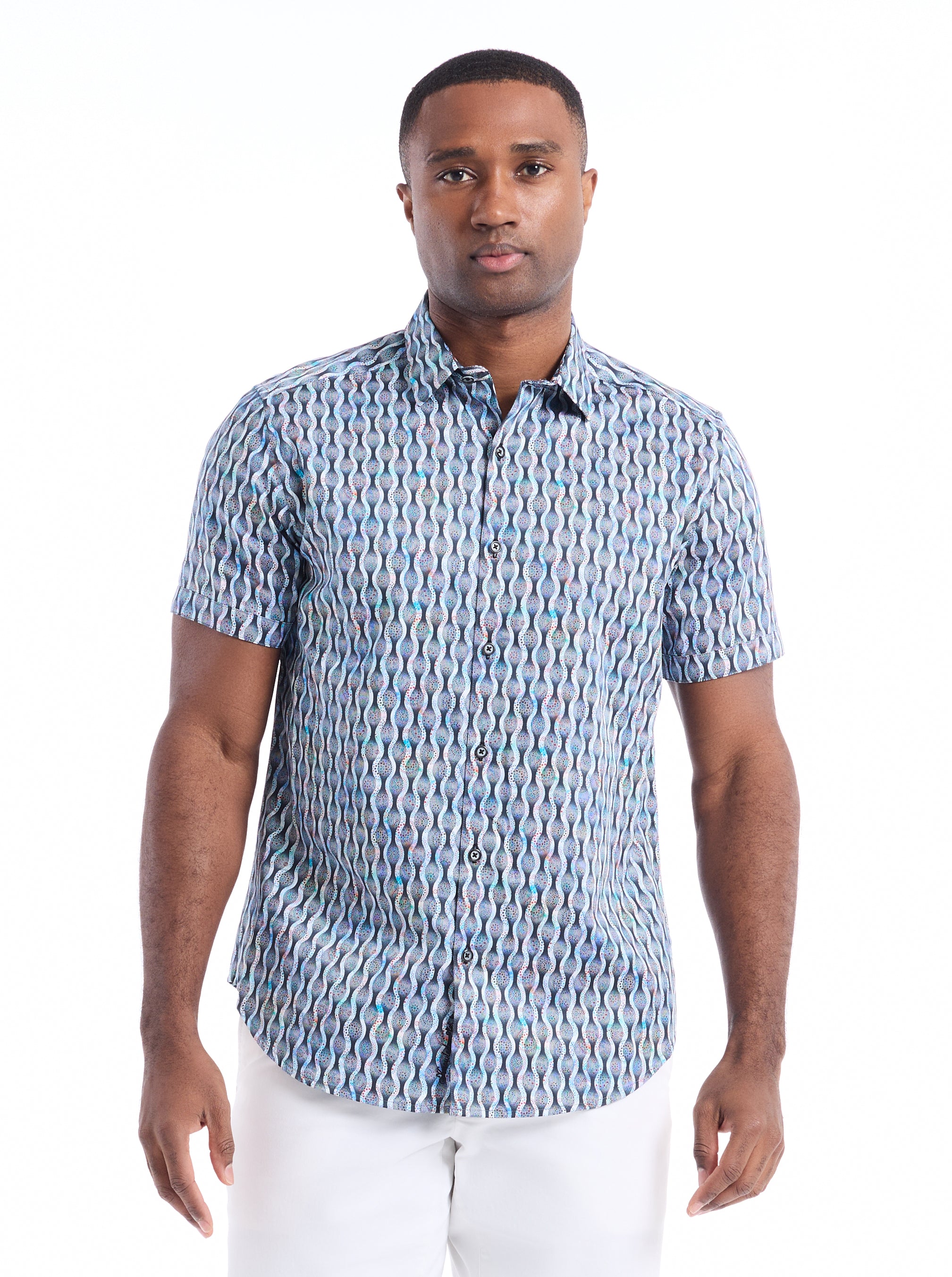 Man wearing a blue patterned shirt on a white background