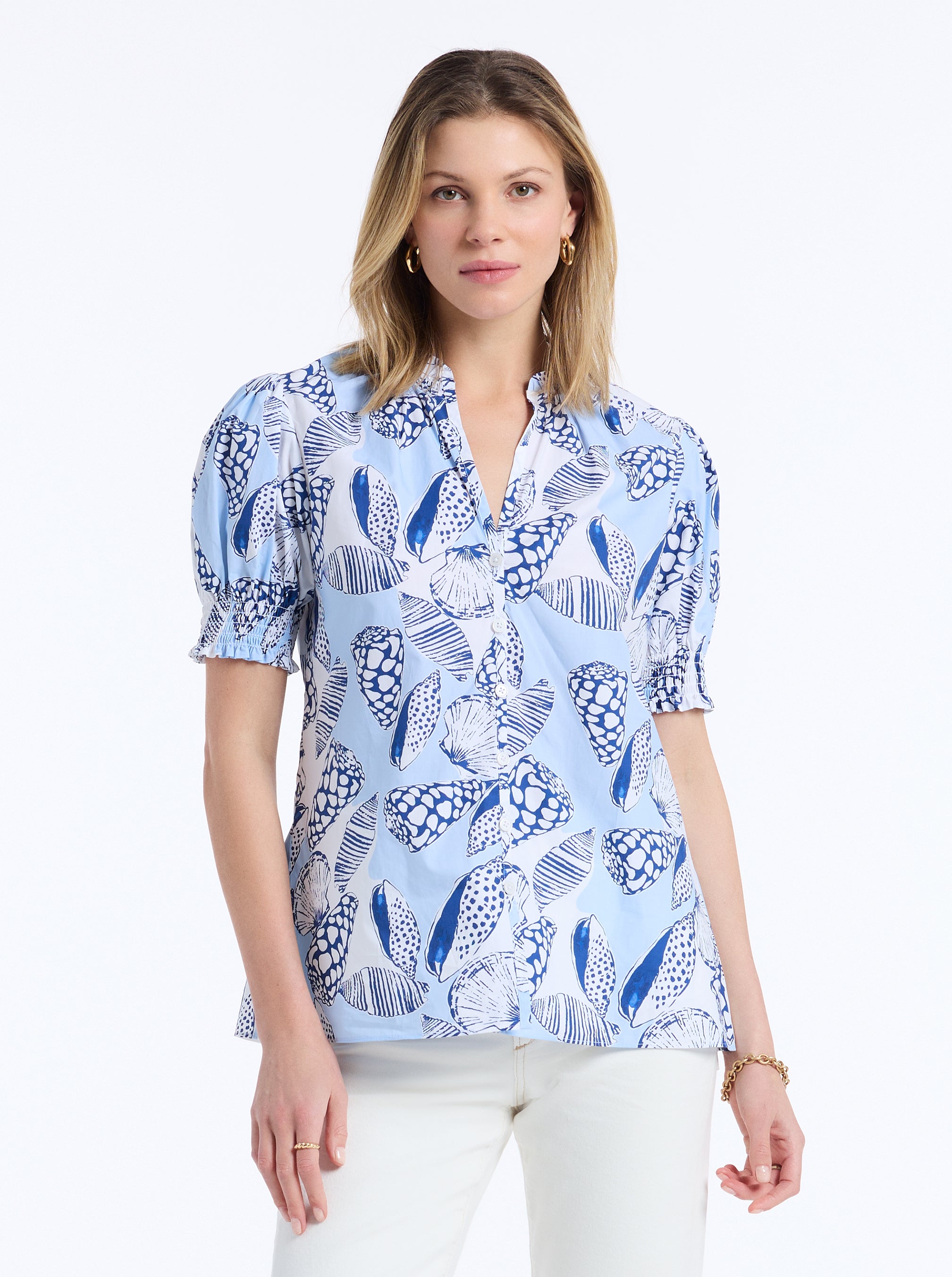 Woman wearing a blue patterned shirt on a white background