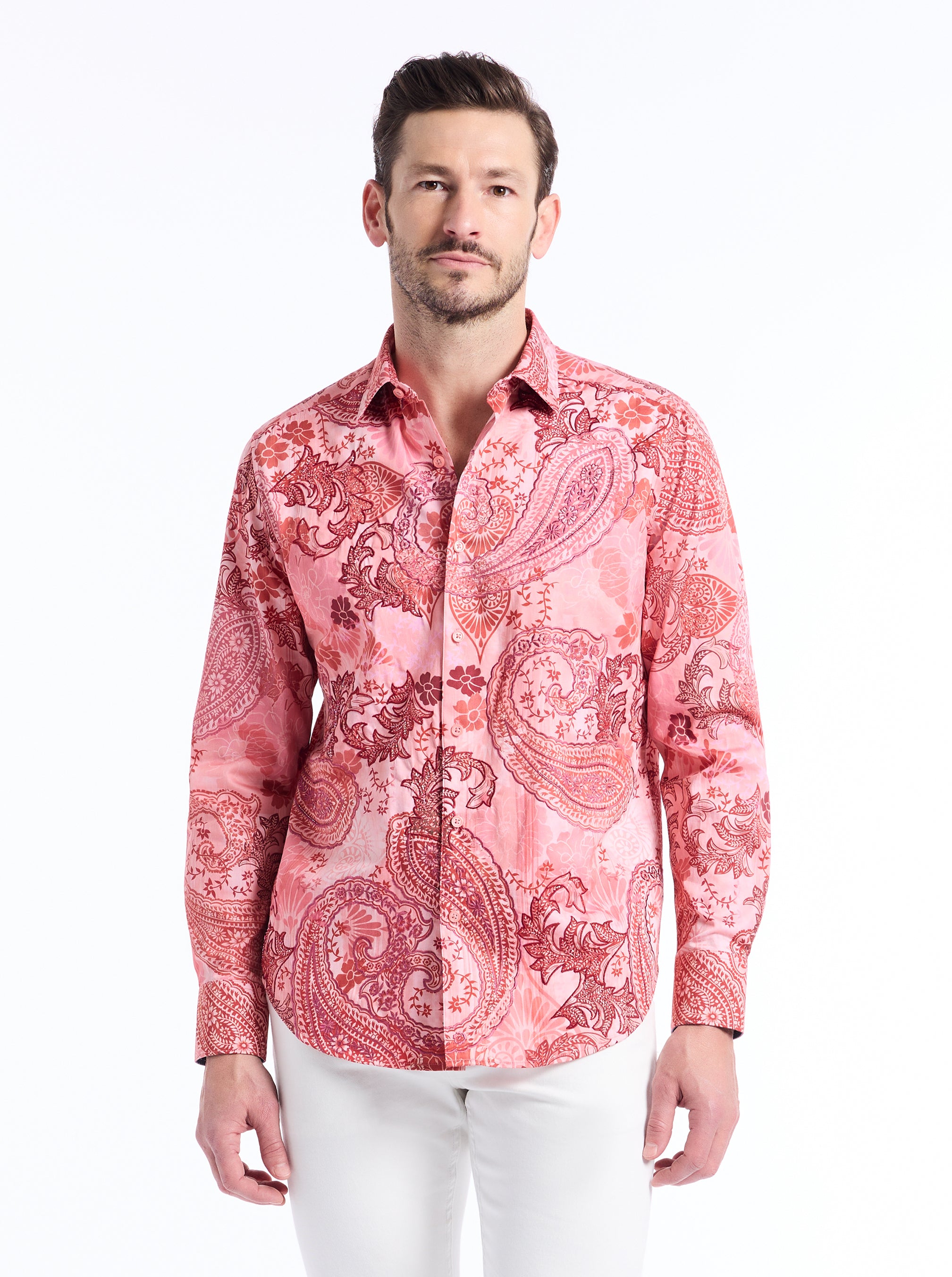 Man wearing a red paisley patterned shirt on a white background