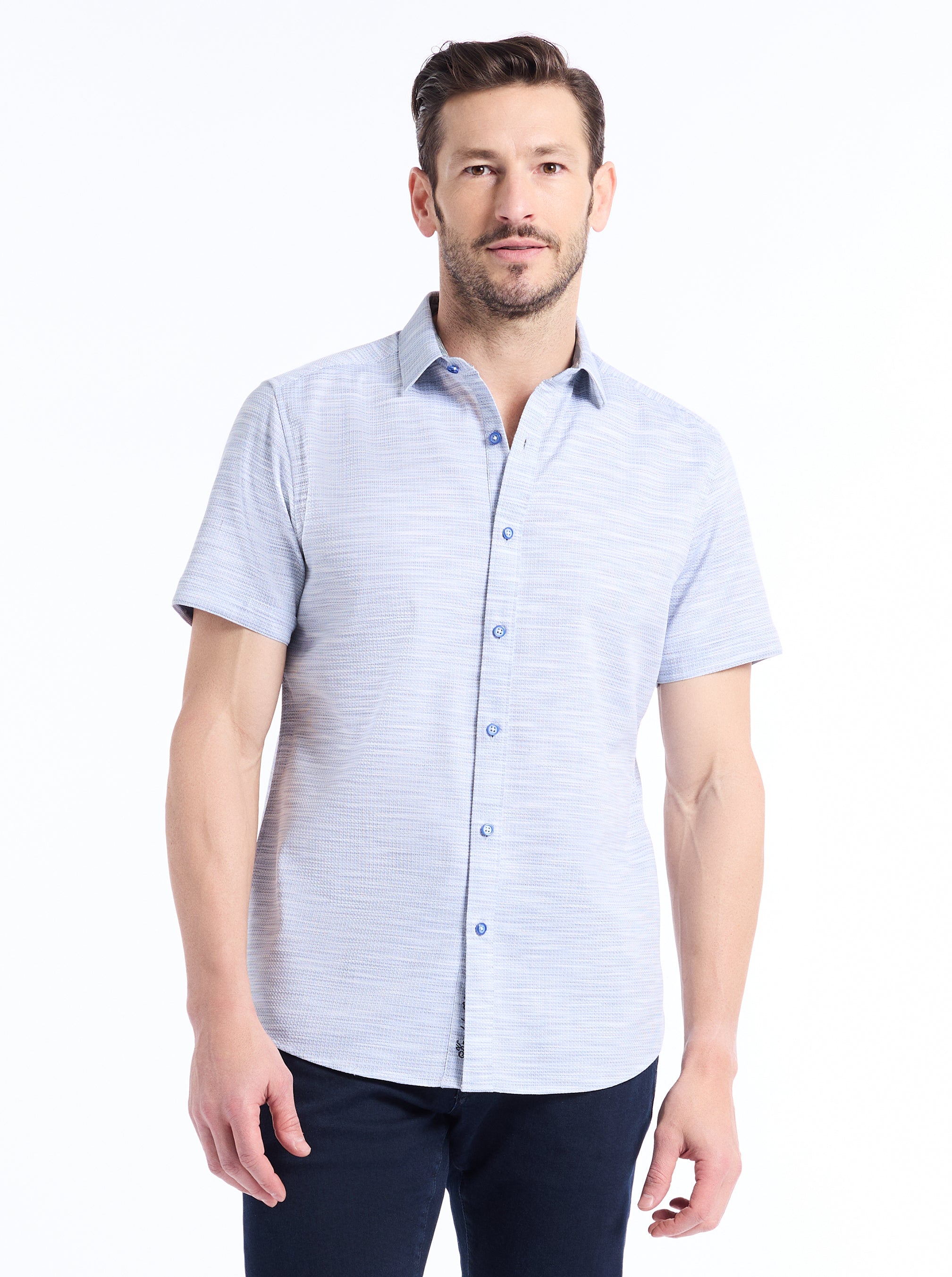 Man wearing a light blue shirt on a white background