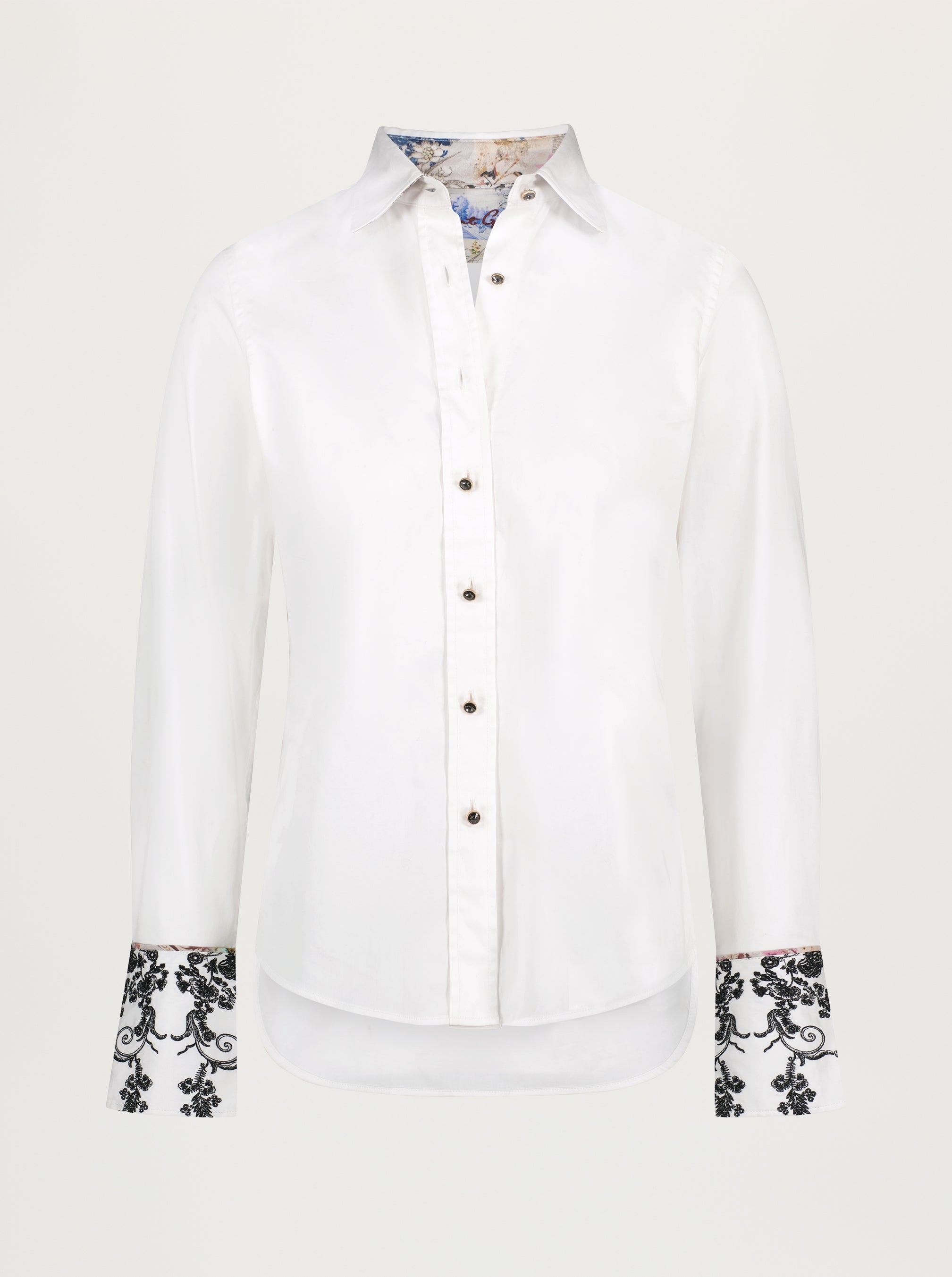 White shirt with floral cuffs on a white background