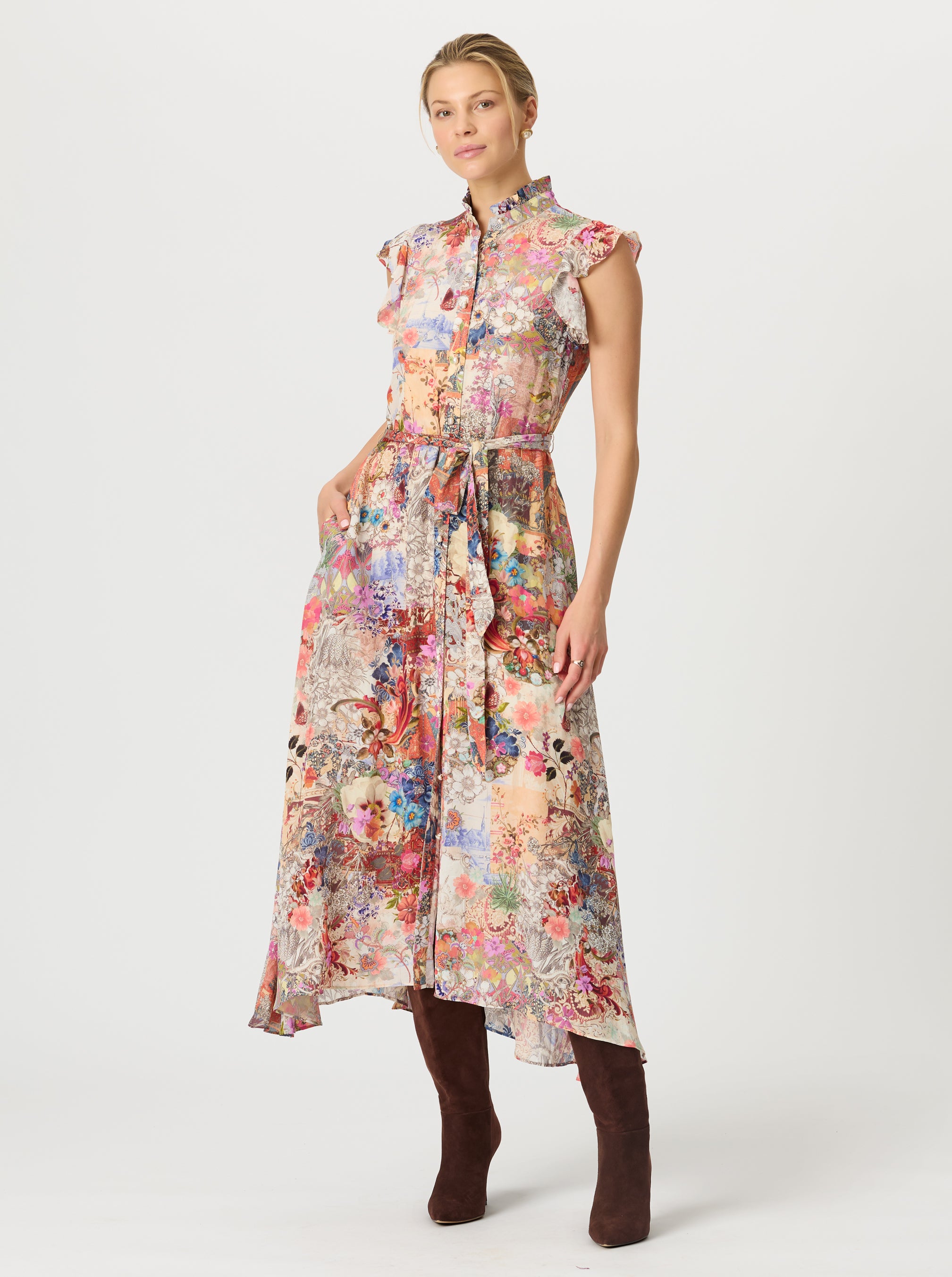 Woman wearing a floral maxi dress on a white background