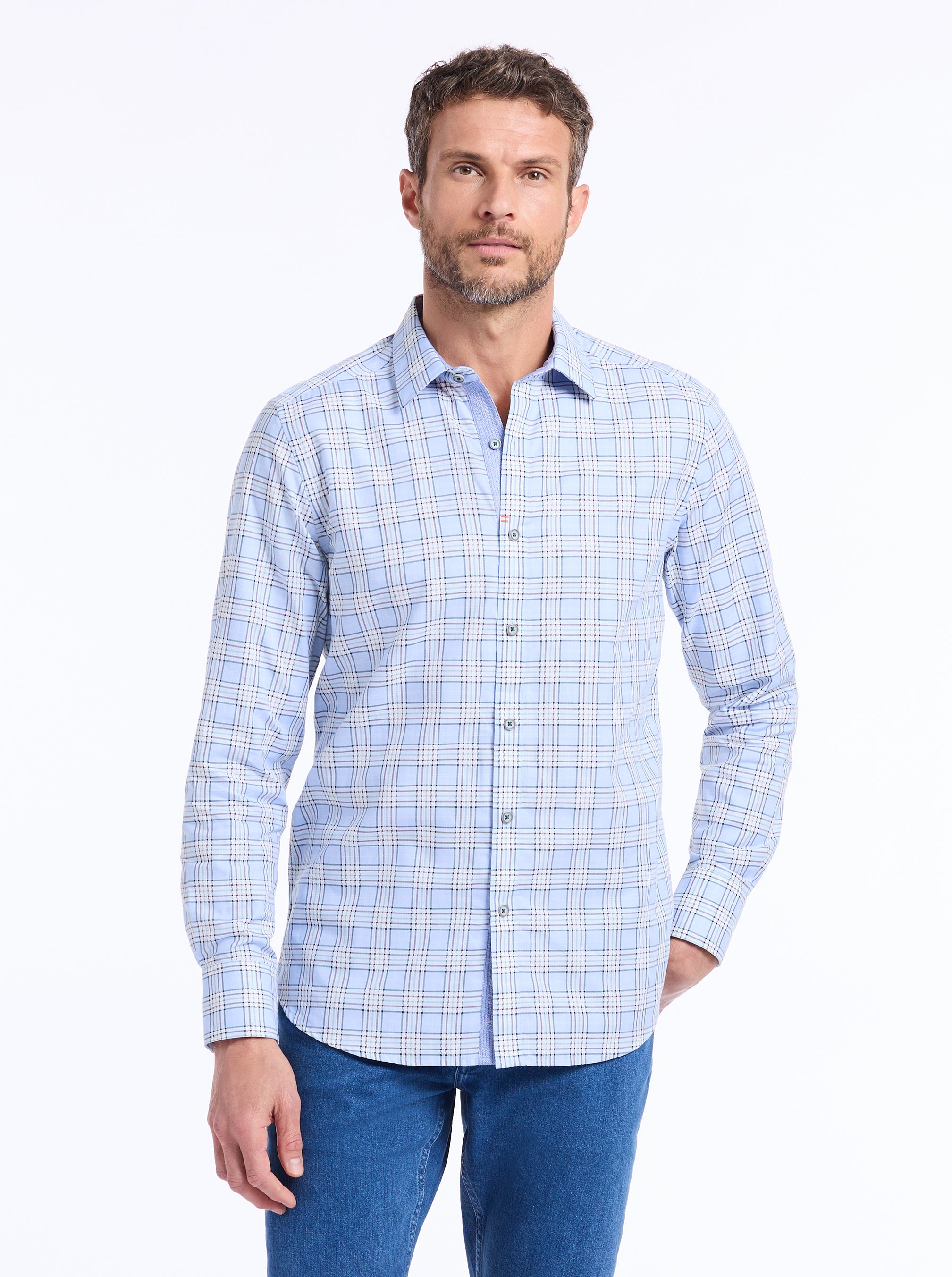 Man wearing a blue checkered shirt on a white background