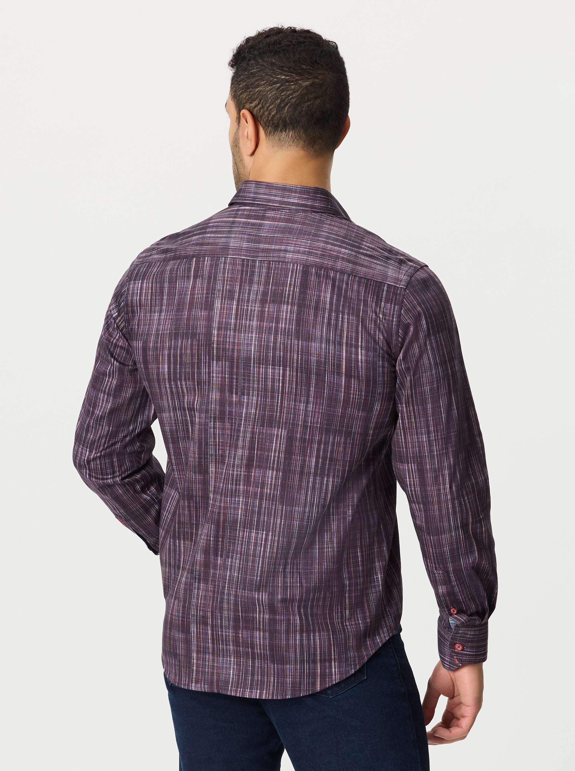 Man wearing a purple plaid shirt on a white background