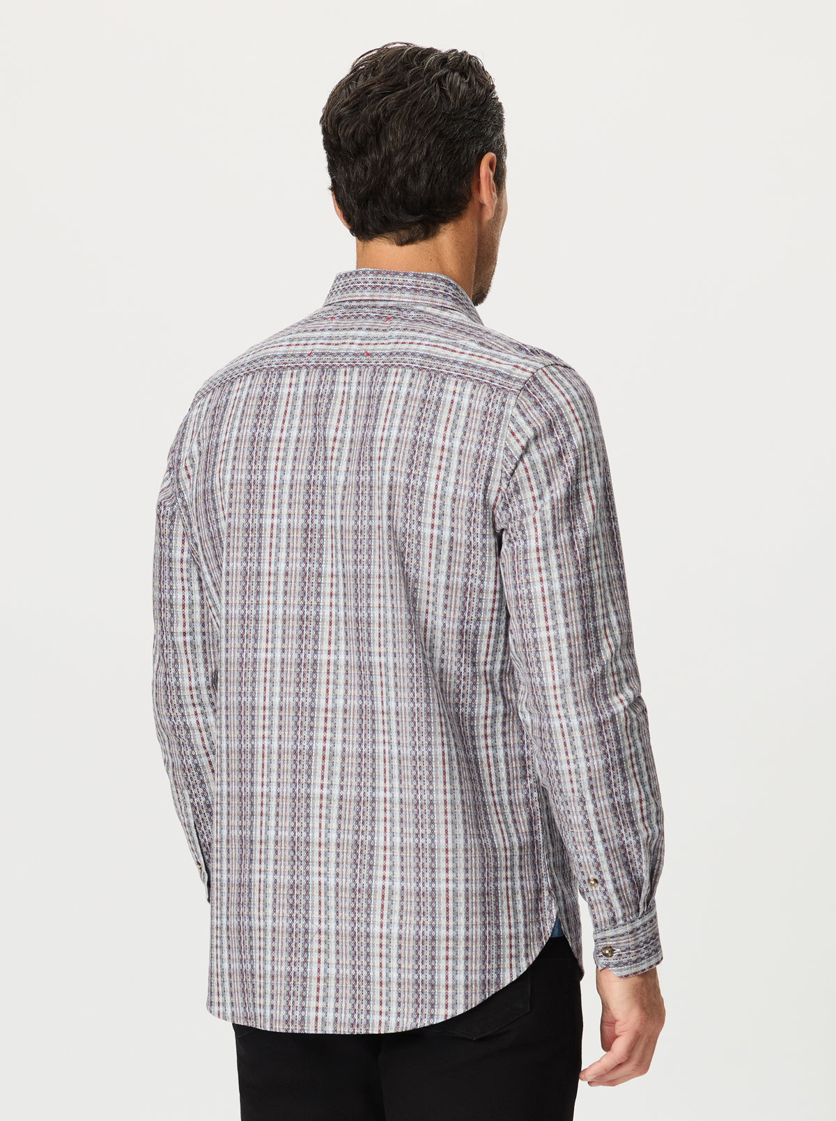 Man wearing a plaid shirt from behind on a white background