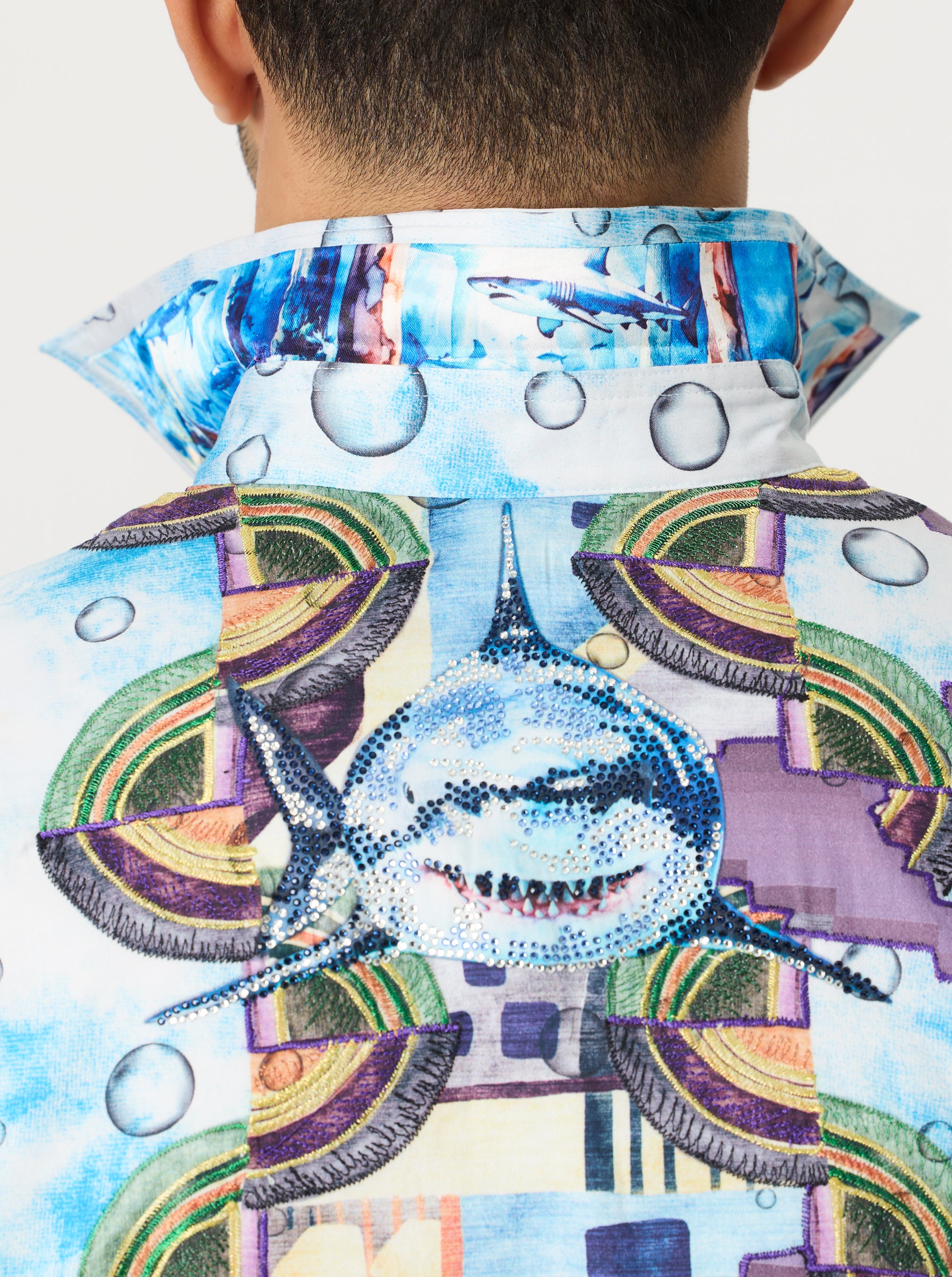 Colorful shirt with shark design and abstract patterns