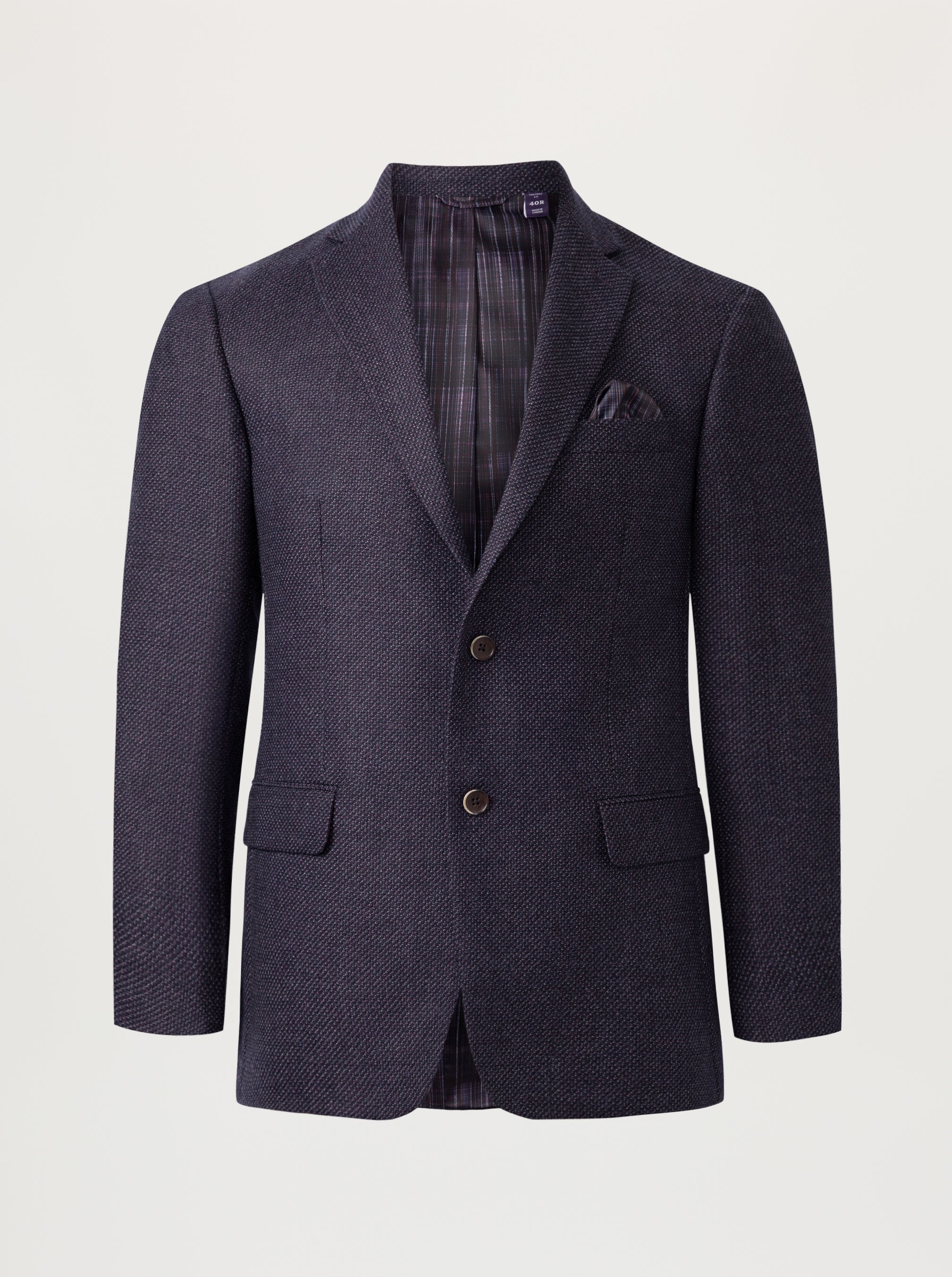 A dark navy blue textured wool blazer with a subtle herringbone pattern, featuring notch lapels, two front buttons, flap pockets, and a matching pocket square, displayed on a neutral light gray background.