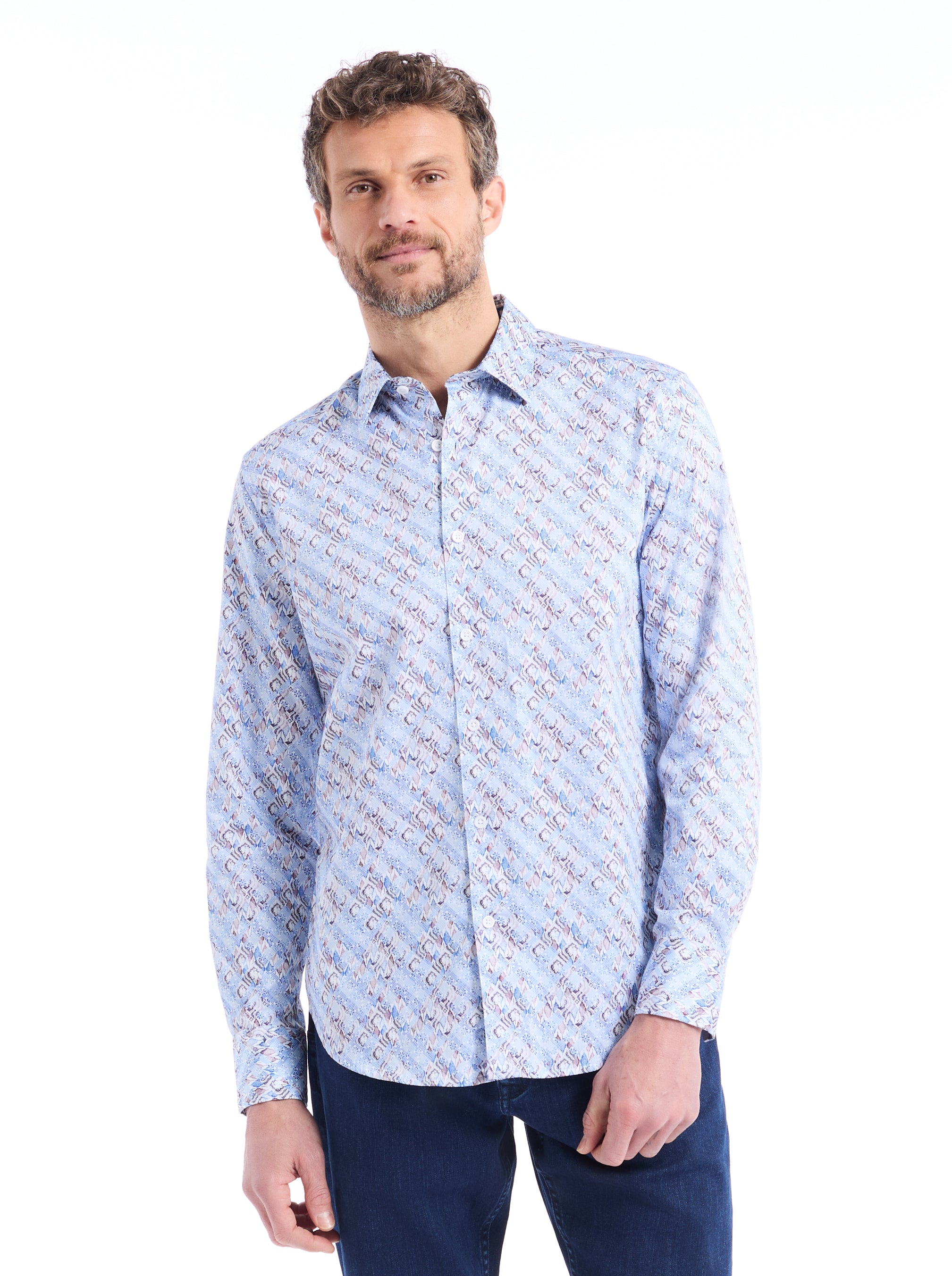 Man wearing a light blue patterned shirt on a white background