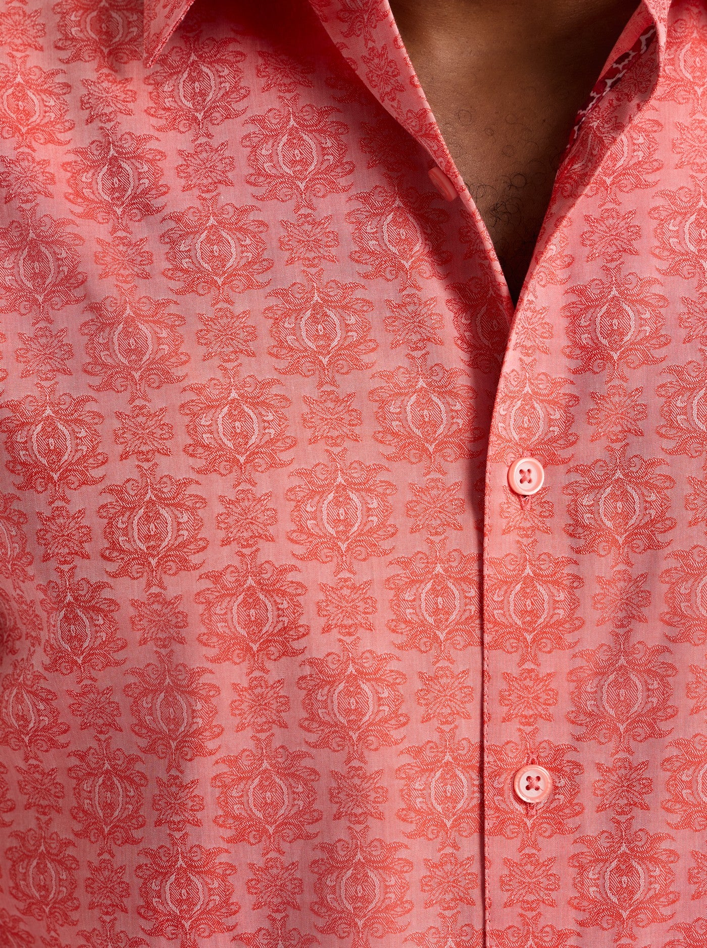 Close-up of a red patterned shirt with buttons