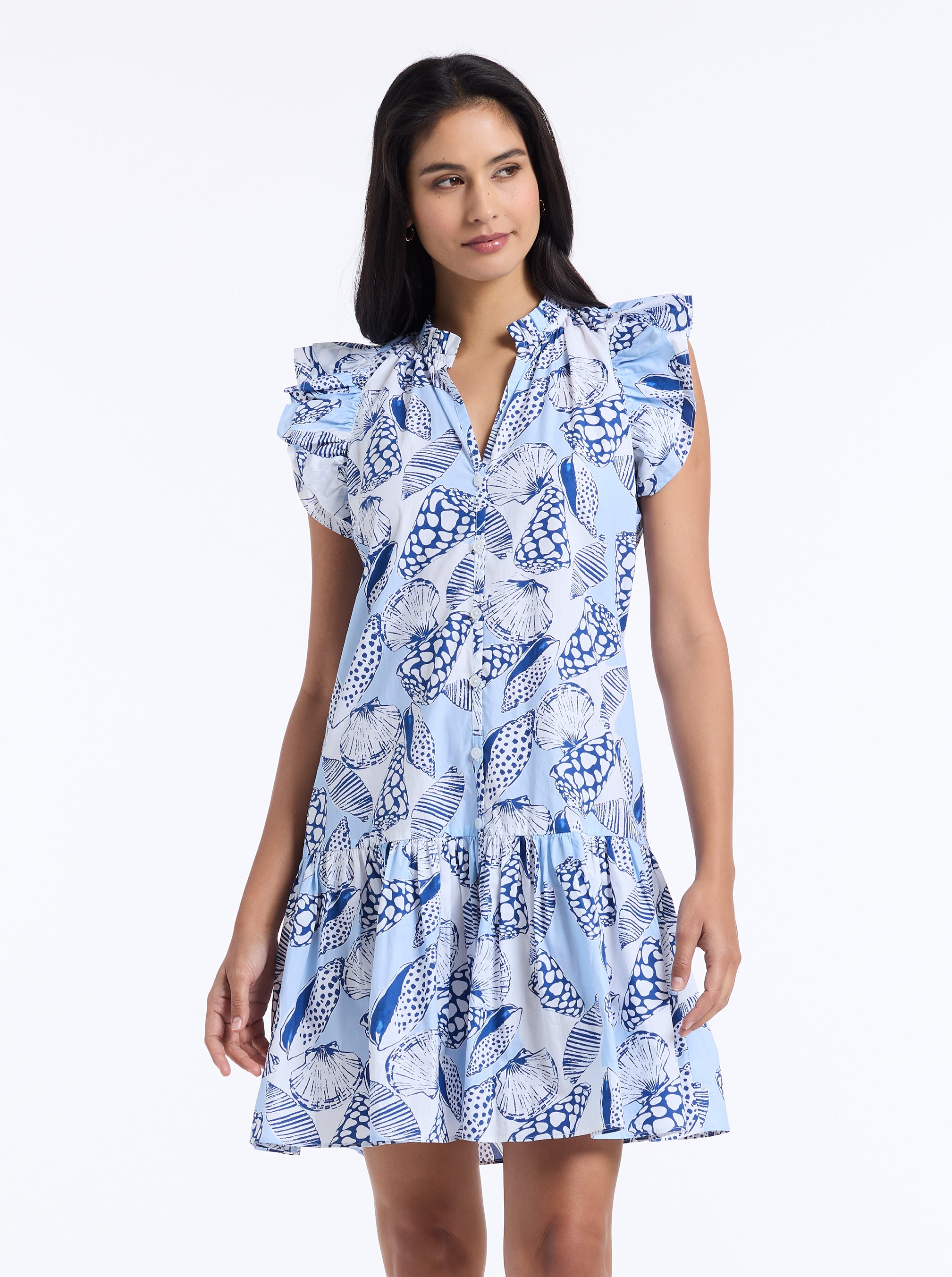 Woman wearing a blue floral dress on a white background