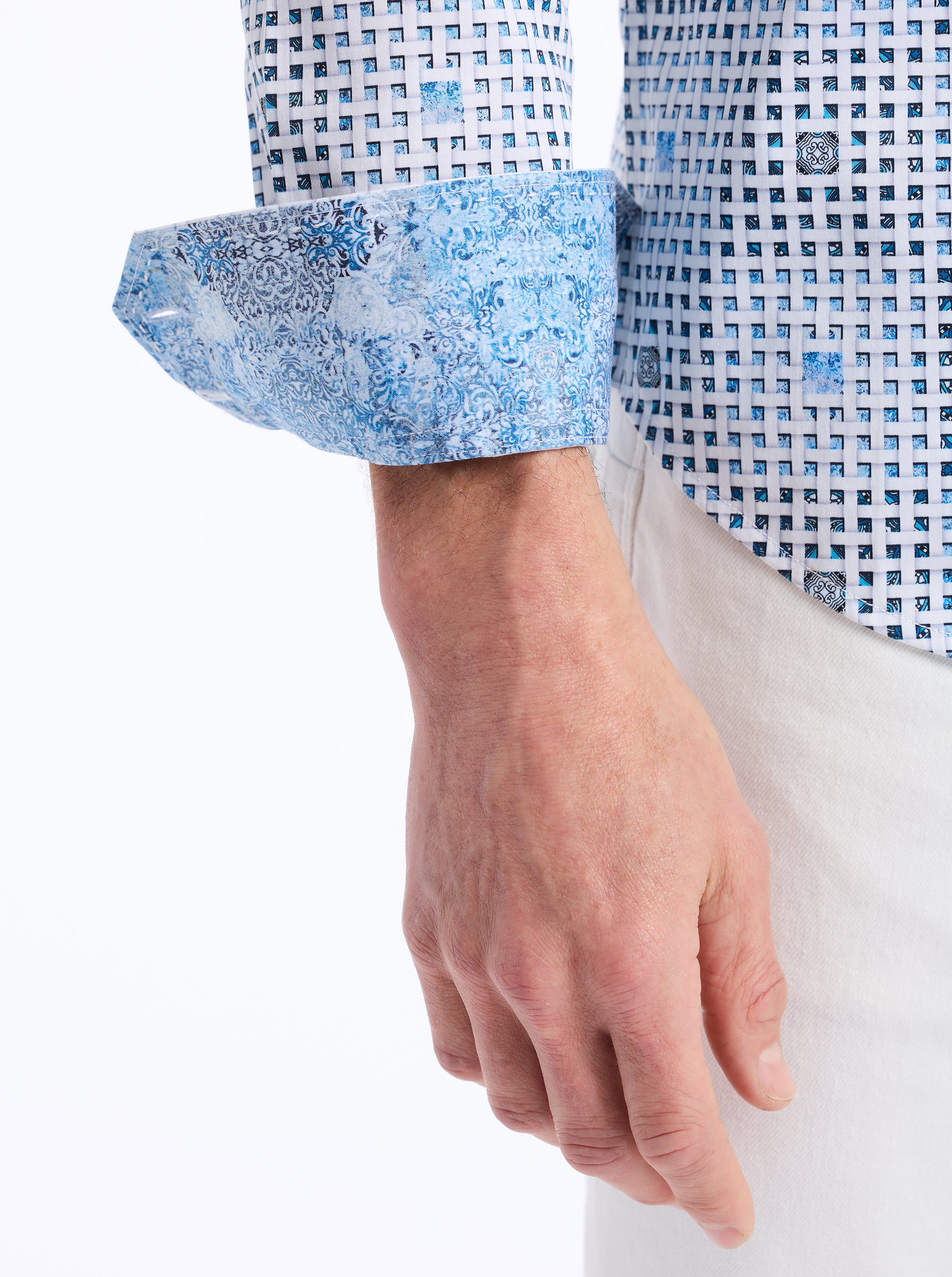 Close-up of a person wearing a blue and white checkered shirt with rolled-up sleeves on a white background