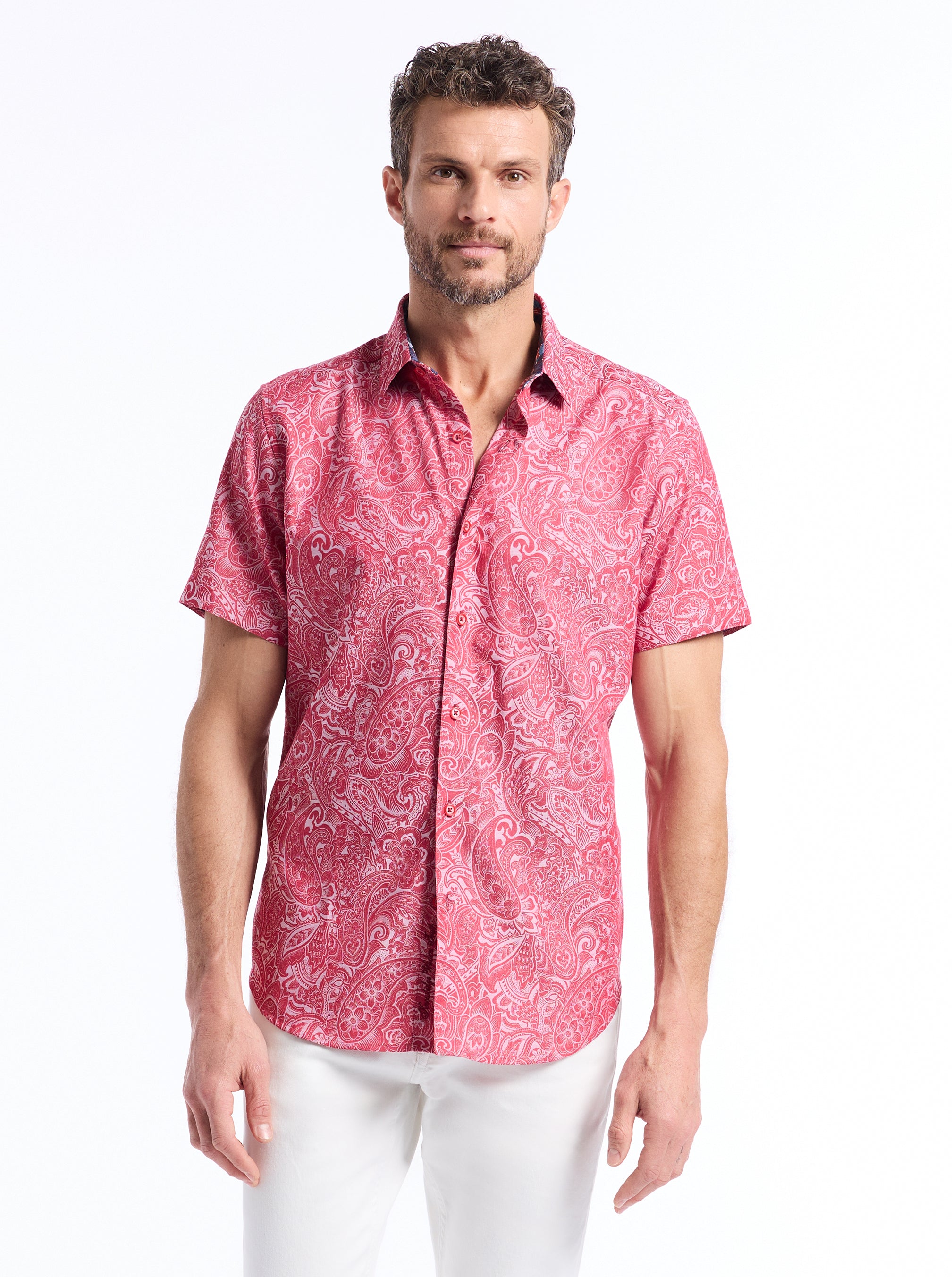 Man wearing a red patterned shirt on a white background