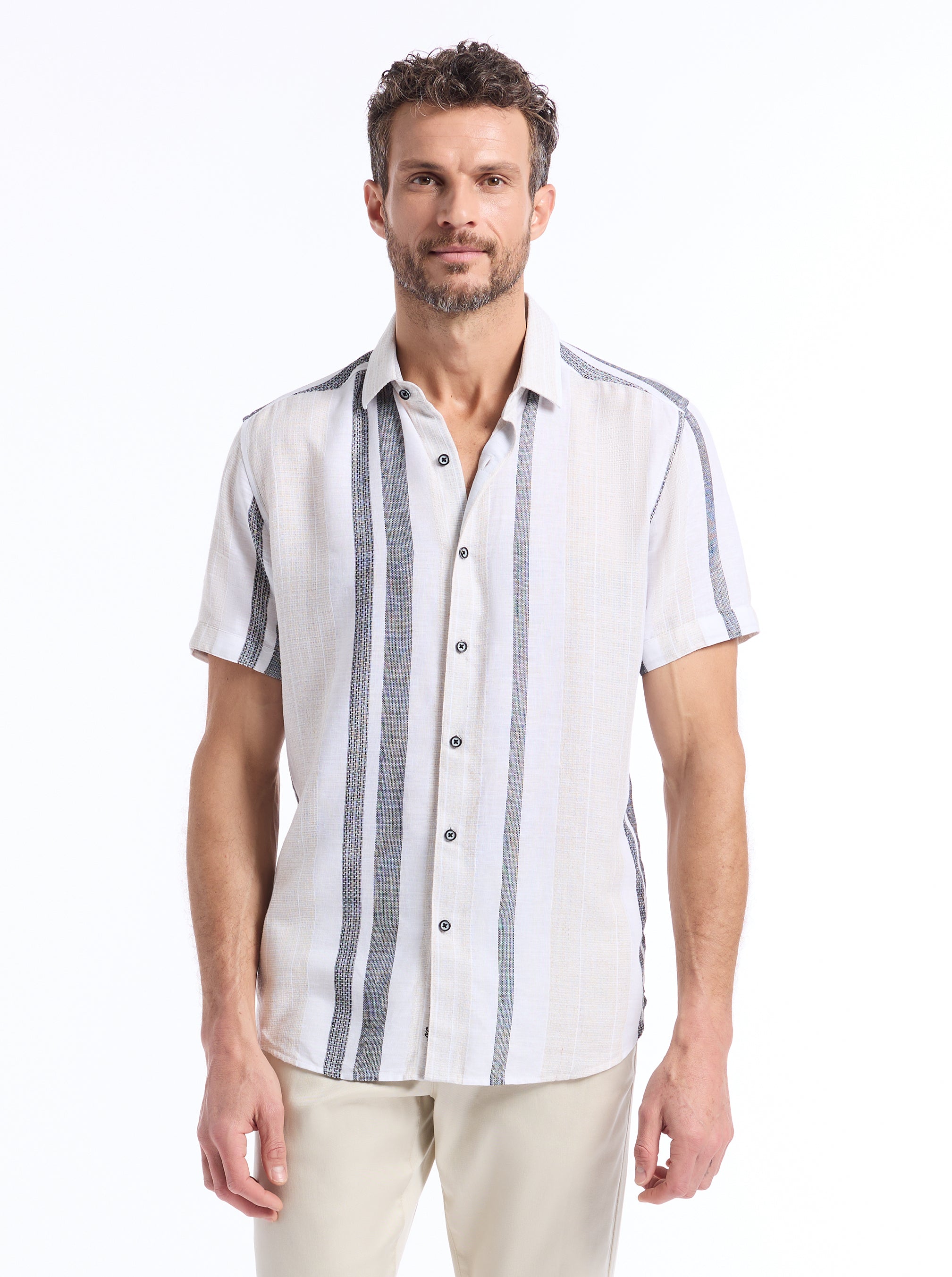 Man wearing a navy and tan striped shirt