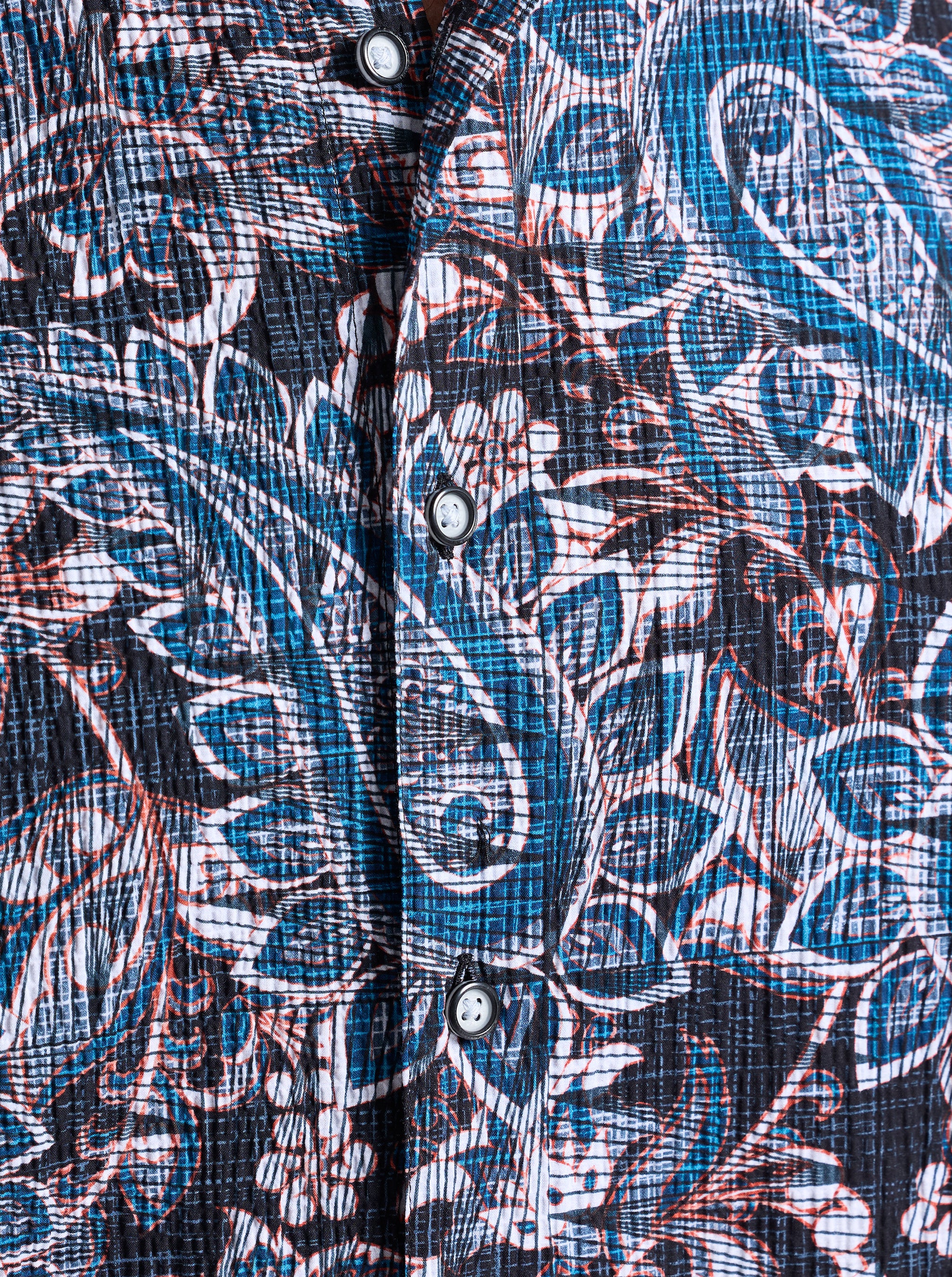 Close-up of a patterned shirt with blue and white design