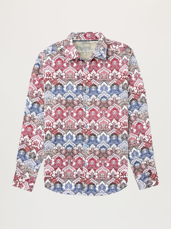 A long-sleeve button-up shirt with an intricate, repeating damask-style pattern in red, blue, beige, and gray, displayed flat against a light gray background.