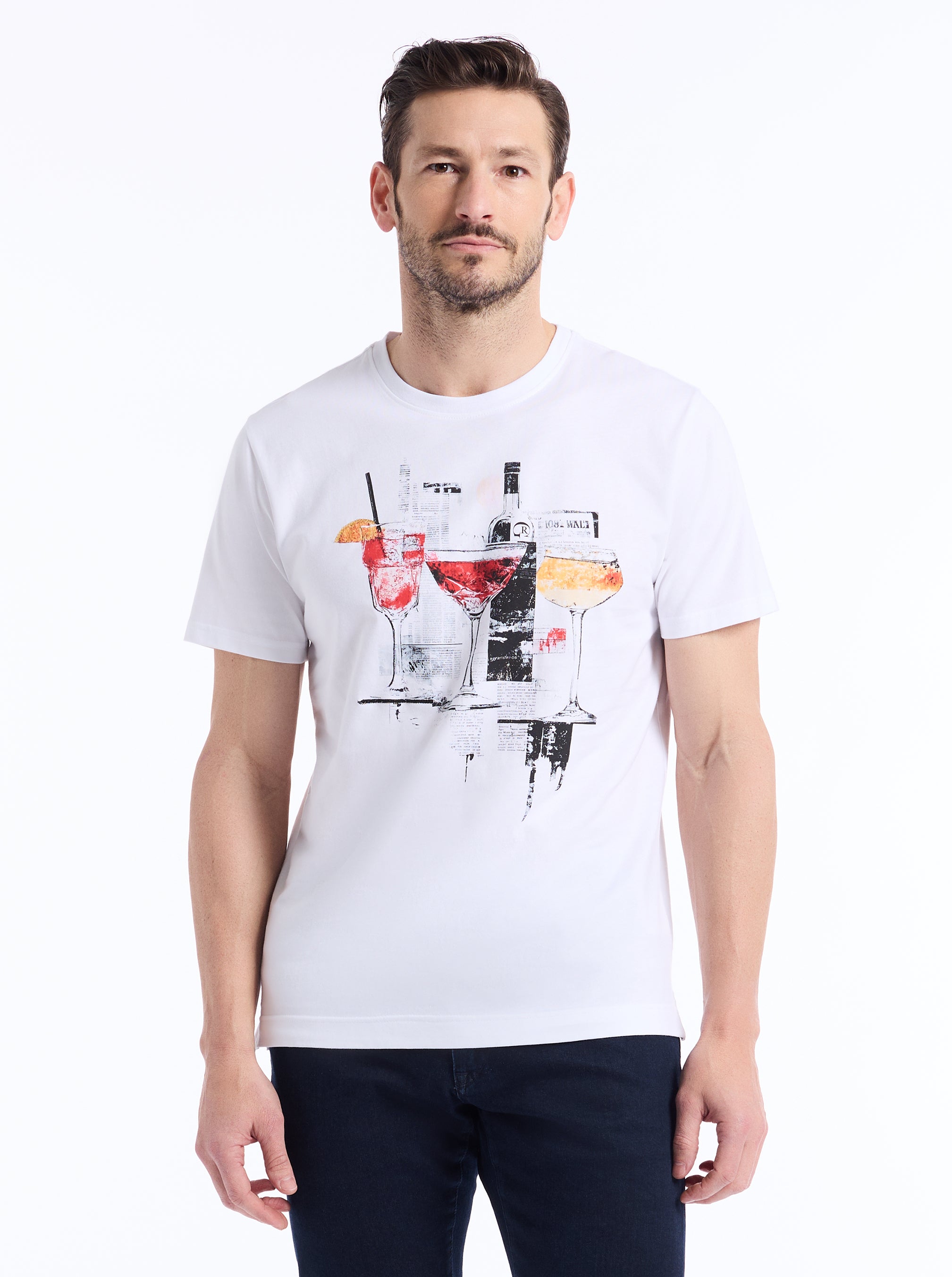 Man wearing a white t-shirt with a graphic design on a white background