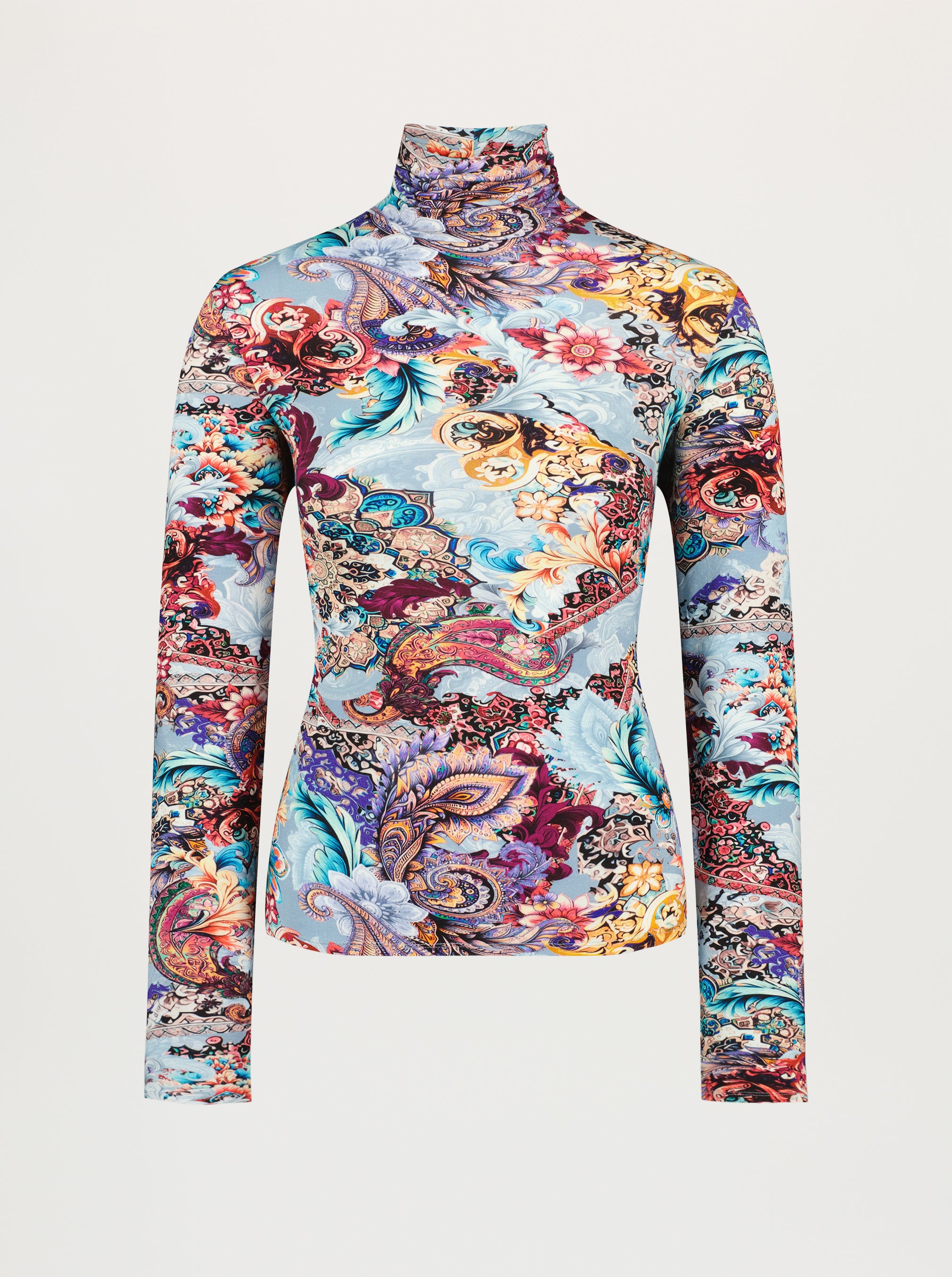 Colorful patterned long-sleeve top on a light gray background