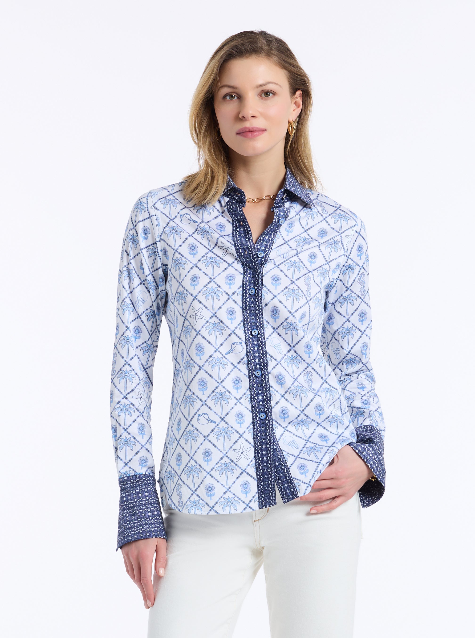 Woman wearing a blue patterned shirt on a white background