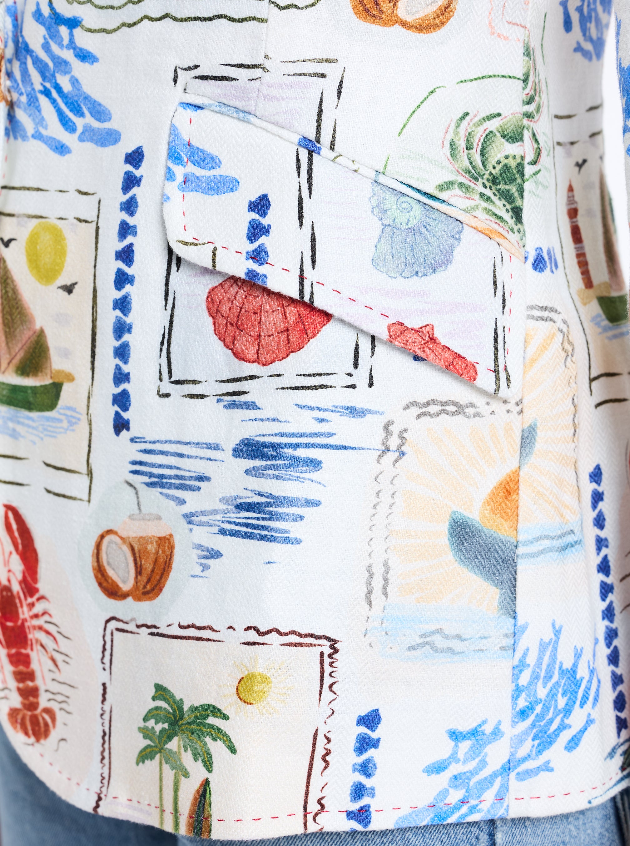 Close-up of a colorful shirt with beach-themed patterns